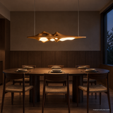 Luma Haven Wood Pendant Light, Wood Color, above a dining table in low light