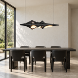 Luma Haven Wood Pendant Light, Black, above a black dining table in daylight