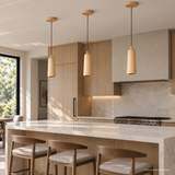 Alden Bloom Wood Pendant Light in Wood Color above a modern kitchen island