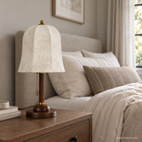 Unlit Rora Morrow Wood Table Lamp on a bedside table in daylight
